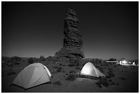 Camp at the base of Standing Rock at night. Canyonlands National Park, Utah, USA. (black and white)