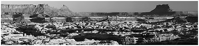 Maze canyons and Chocolate Drops from Standing Rock, early morning. Canyonlands National Park (Panoramic black and white)