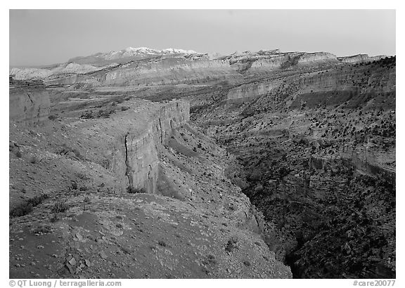 Waterpocket Fold and snowy mountains at dusk. Capitol Reef National Park (black and white)