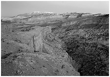 Waterpocket Fold and snowy mountains at dusk. Capitol Reef National Park ( black and white)