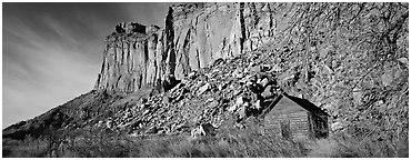 Fruita pioneer school house at the base of sandstone cliffs. Capitol Reef National Park (Panoramic black and white)