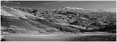 Mudstone landscape and snowy mountains, Cathedral Valley. Capitol Reef National Park (Panoramic black and white)