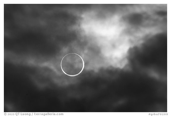 Sun and clouds, begining of annularity, eclipse of Oct 14, 2023. Great Basin National Park (black and white)