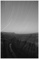 Star trails and narrow gorge of  Colorado River at Toroweap. Grand Canyon National Park, Arizona, USA. (black and white)