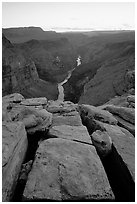 Cracks and Colorado River at Toroweap, dusk. Grand Canyon National Park, Arizona, USA. (black and white)