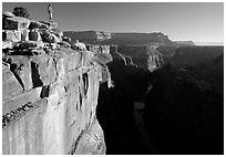 Hiker looking down into  Grand Canyon at Toroweap, early morning. Grand Canyon National Park ( black and white)