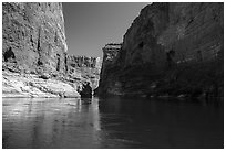 River-level view of redwall limestone canyon walls dropping straight into Colorado River. Grand Canyon National Park ( black and white)
