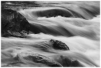 Boulders and rapids with color from canyon walls reflected. Grand Canyon National Park ( black and white)