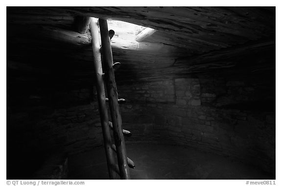 Ladder through a smoke hole in Spruce Tree house. Mesa Verde National Park (black and white)
