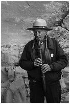 Native American Ranger plays flute to honor ancestors. Mesa Verde National Park ( black and white)