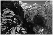 Hiker holds onto chain, Angels Landing. Zion National Park ( black and white)