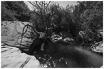 Man jumping into water, Pine Creek. Zion National Park ( black and white)