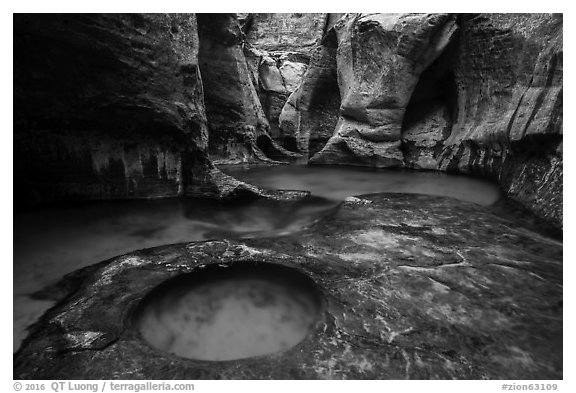 Water flowing over pools and fluted walls, Subway. Zion National Park (black and white)