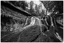 Waterfall over red travertine in the spring. Zion National Park ( black and white)