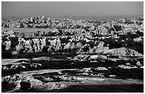View over eroded ridges from Pinacles overlook, sunrise. Badlands National Park, South Dakota, USA. (black and white)