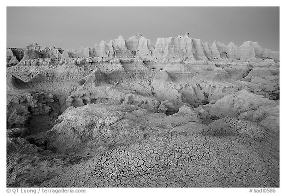 Cracked mud and erosion formations, Cedar Pass, dawn. Badlands National Park (black and white)