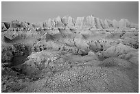 Cracked mud and erosion formations, Cedar Pass, dawn. Badlands National Park ( black and white)