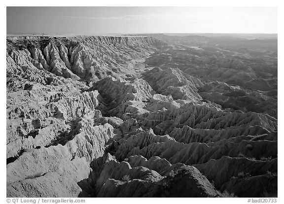 Basin of spires, pinacles, and deeply fluted gorges,  southern unit, early morning. Badlands National Park (black and white)