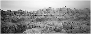 Badlands formations with pastel hues at dawn. Badlands National Park (Panoramic black and white)