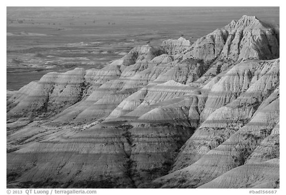 Eroded sedimentary rock layers at sunrise. Badlands National Park, South Dakota, USA.