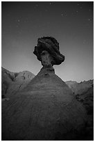 Pedestal rock at badlands at night. Badlands National Park, South Dakota, USA. (black and white)
