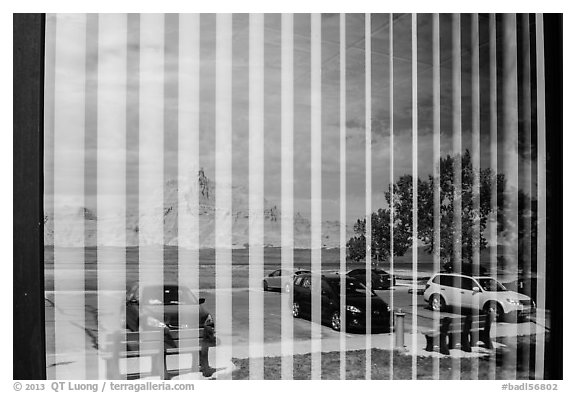 Badlands and parking lot, Visitor Center window reflexion. Badlands National Park (black and white)