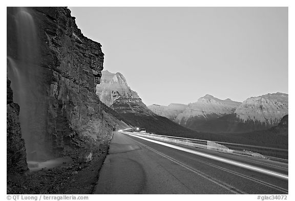 Roadside waterfall and light trail, Going-to-the-Sun road. Glacier National Park (black and white)