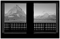 Grinnell Point and Swiftcurrent Lake framed by windows of Many Glacier Lodge. Glacier National Park ( black and white)