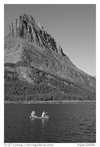 Red canoe on Swiftcurrent Lake. Glacier National Park (black and white)