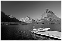 Deck and small boats on Swiftcurrent Lake. Glacier National Park, Montana, USA. (black and white)