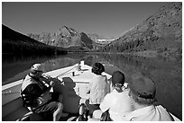 Riding the tour boat on Lake Josephine. Glacier National Park, Montana, USA. (black and white)