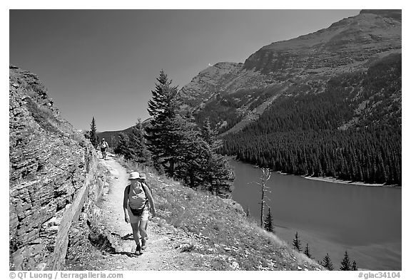 Hikers on trail above Lake Josephine. Glacier National Park (black and white)