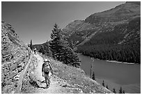 Hikers on trail above Lake Josephine. Glacier National Park ( black and white)