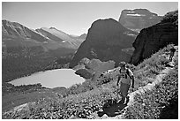 Hikers on trail overlooking Grinnell Lake. Glacier National Park ( black and white)