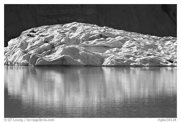 Grinnell Glacier reflected in Upper Grinnel Lake. Glacier National Park (black and white)