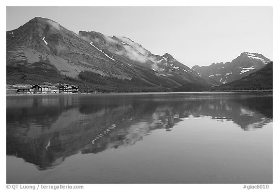 Many Glacier Hotel reflected in Swiftcurrent Lake. Glacier National Park (black and white)