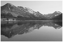 Many Glacier Hotel reflected in Swiftcurrent Lake. Glacier National Park ( black and white)
