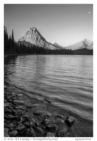 Two Medicine lakeshore with Sinopah Mountain and moon. Glacier National Park (black and white)