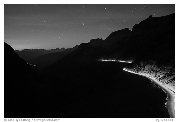 Going-to-the-Sun road at dusk with car lights. Glacier National Park (black and white)