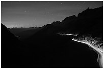 Going-to-the-Sun road at dusk with car lights. Glacier National Park ( black and white)
