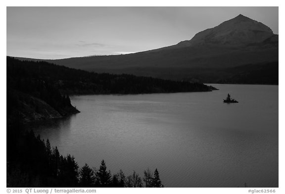 Saint Mary Lake and Wild Goose Island with colors of sunrise in clouds. Glacier National Park (black and white)
