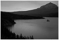 Saint Mary Lake and Wild Goose Island with colors of sunrise in clouds. Glacier National Park ( black and white)