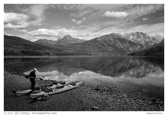 Kayaker readying gear, Kintla Lake. Glacier National Park (black and white)