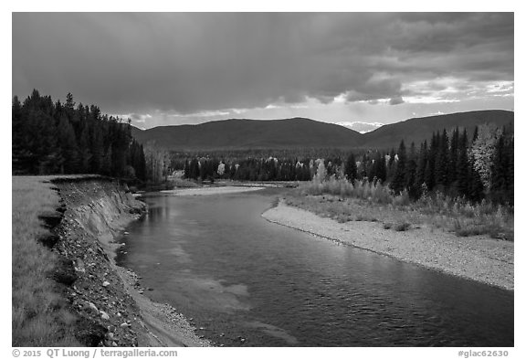 Dark clouds over North Fork of Flathead River in autumn. Glacier National Park (black and white)