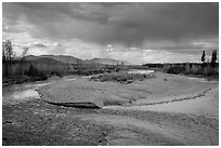 Storm clouds over wide stretch of North Fork of Flathead River. Glacier National Park ( black and white)
