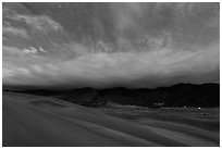 Dunes and clouds at night. Great Sand Dunes National Park, Colorado, USA. (black and white)