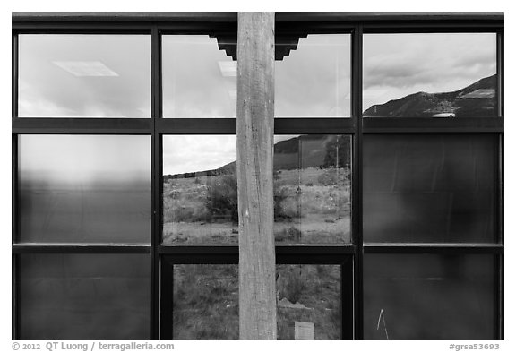 Grasslands and mountains, visitor center window reflexion. Great Sand Dunes National Park and Preserve (black and white)