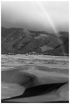 Rainbow over dune field. Great Sand Dunes National Park, Colorado, USA. (black and white)