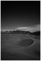 Dunes and Sangre de Cristo Mountains at night. Great Sand Dunes National Park, Colorado, USA. (black and white)