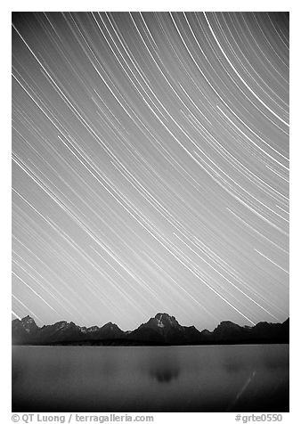 Star trails on Teton range above Jackson lake, dusk. Grand Teton National Park (black and white)